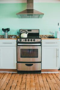 A stainless steel stove in a kitchen.