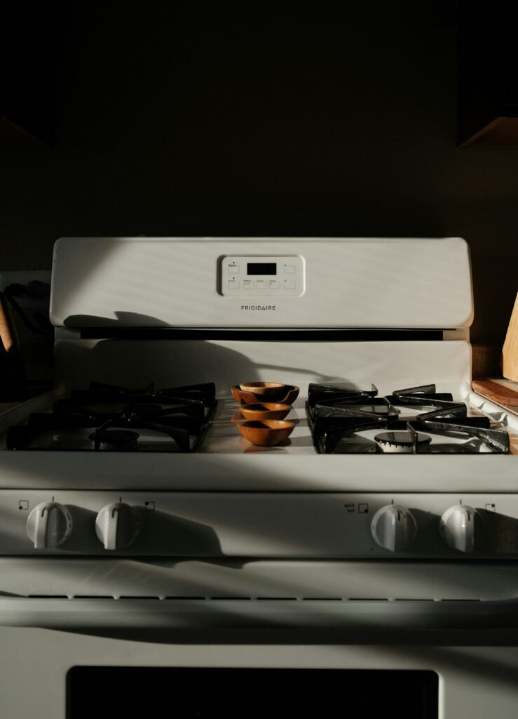 a white stove in a kitchen.