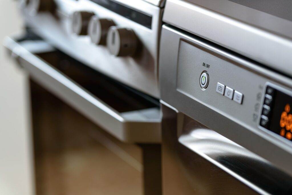 A close up of an oven with a digital display.