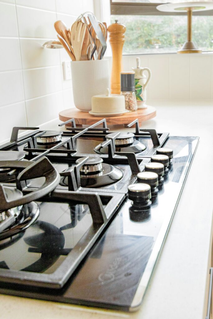 a black stove top in a kitchen.