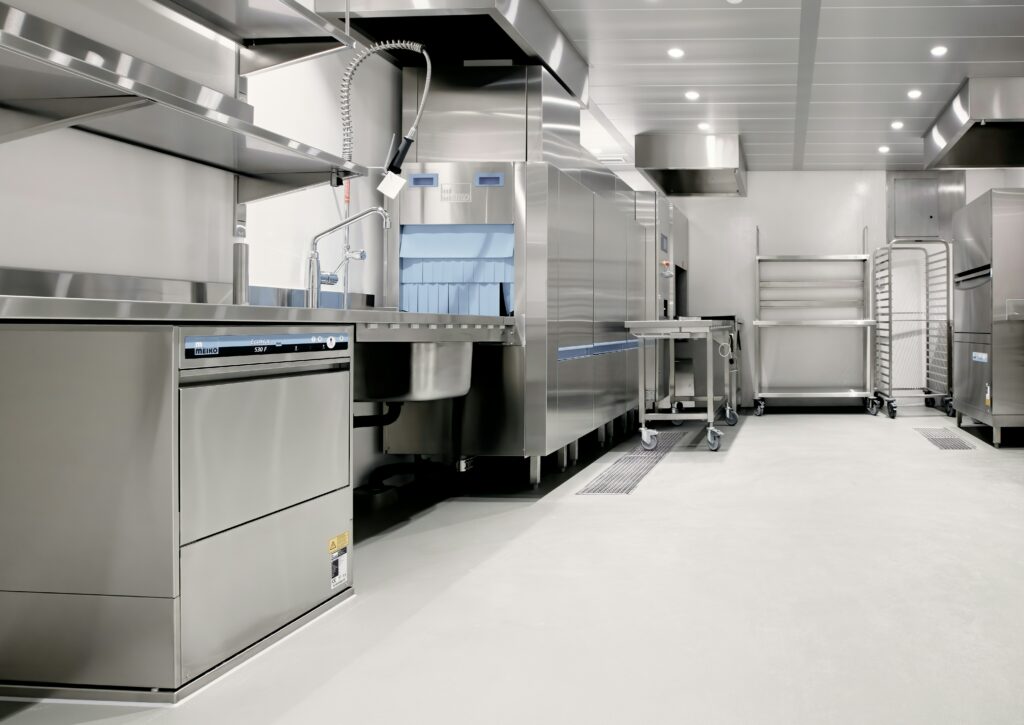 a commercial kitchen with stainless steel appliances.