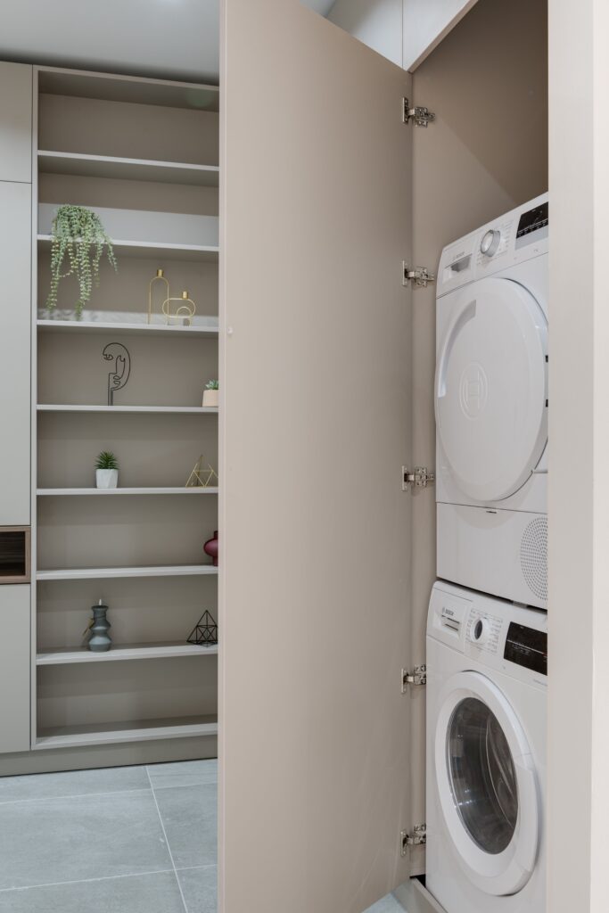 a laundry room with a washer and dryer.