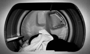 A black and white photo of a washing machine.